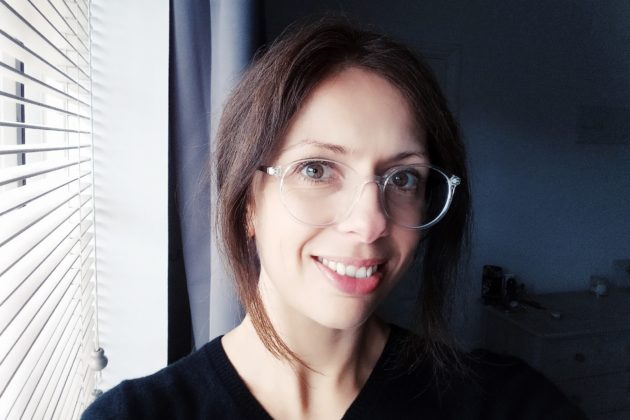 Woman wearing glasses and smiling