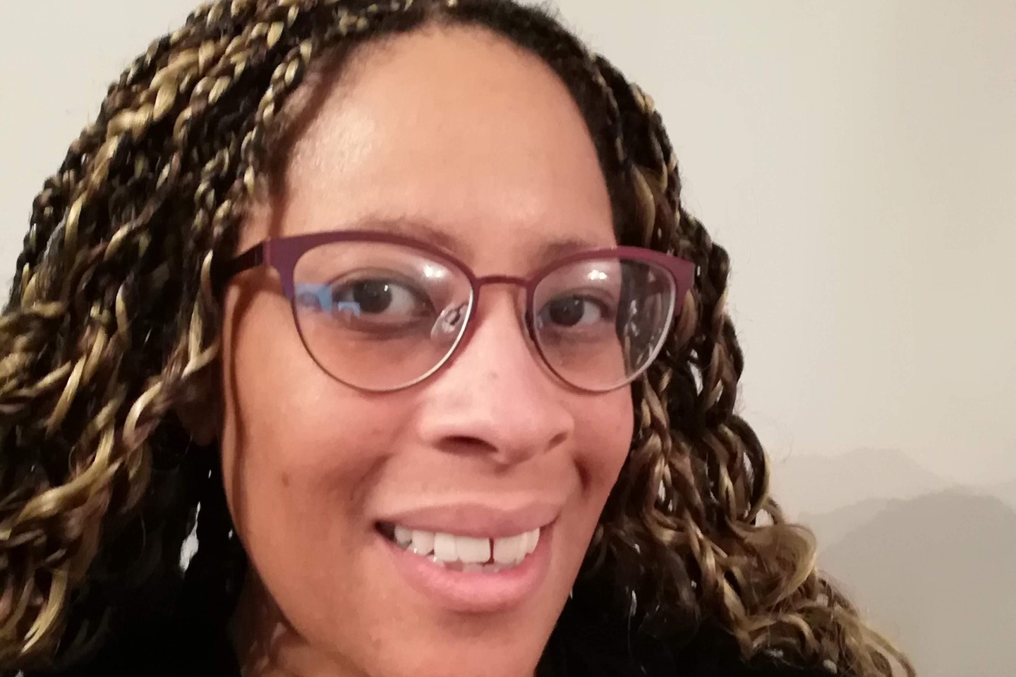 Woman wearing glasses smiling