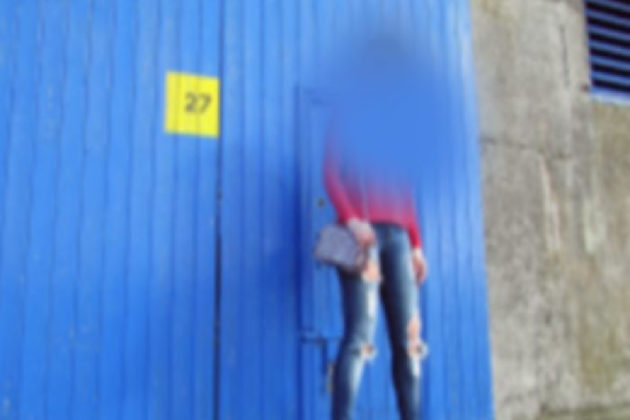 Simulating the view of someone with Stargardt's, half the woman disappears, filled in with the background colour, which is blue. People with Stargardt’s disease generally see everything’s a little blurry with a big empty blind spot in the middle.