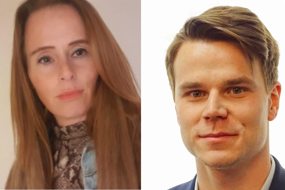 Woman smiling with man smiling on the right hand side