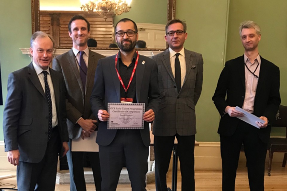 Five males standing, with David Hopkins holding a GCS Early Talent Programme Certificate of Completion.