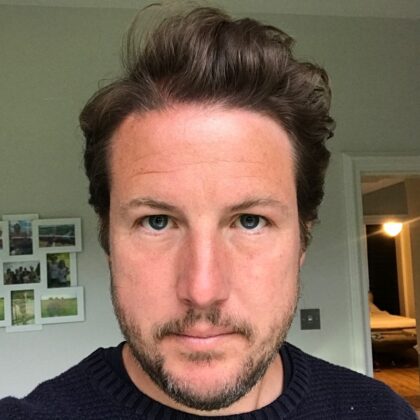 Portrait photo of James Cox, Director of Communications at the Department for Education.