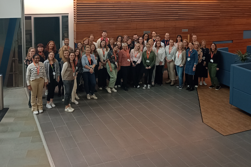Group of marketing professionals in a large open plan office