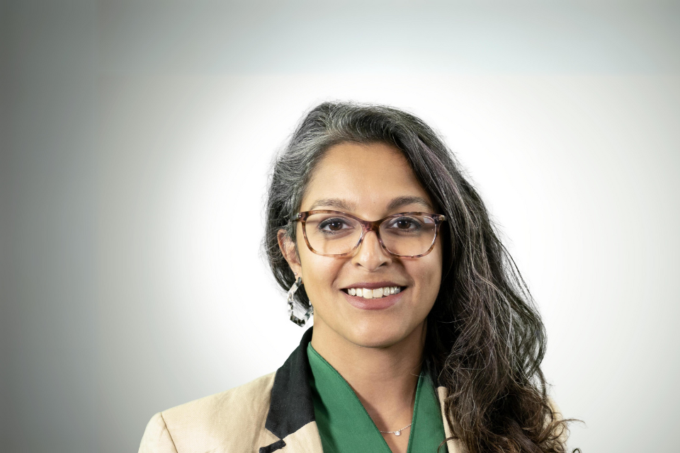 Portrait headshot of Syma Cullasy-Aldridge who is the Director of Communications at DWP.