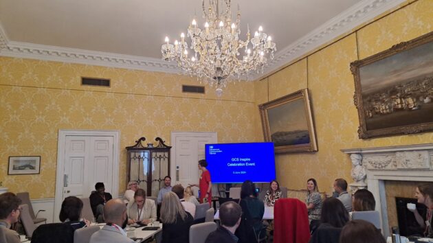 Leah McTaggart , Deputy Director of the Government Communication Service (GCS) People and Membership team, addressing the Inspire participants at the Inspire celebration event.