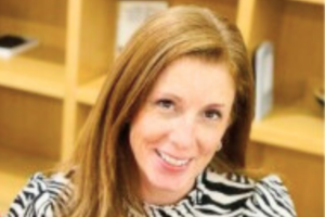 Lisa Sutherland, GCS Applied Innovation Lead, smiling at the camera