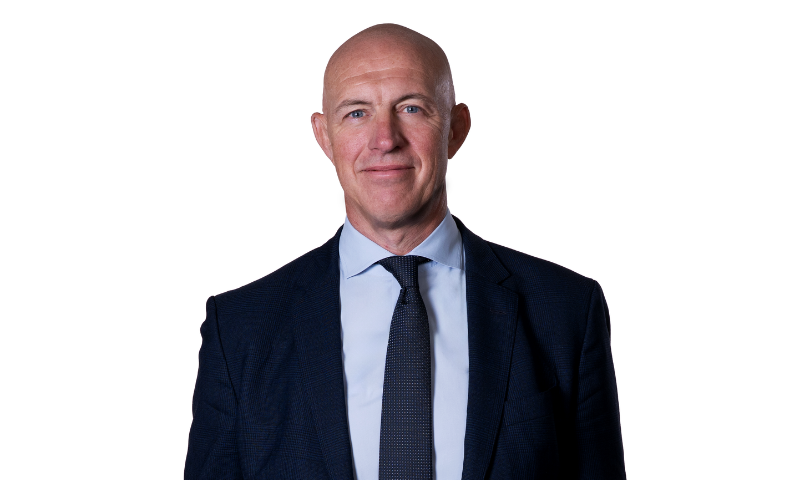 Picture of David Dinsmore in colour wearing a suit and pie with a white background