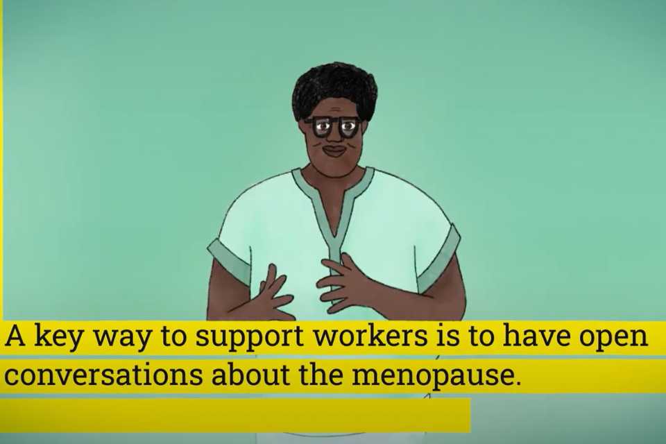 A screenshot of a short youtube video to explain the Menopause and Equality Act. The video is paused on a graphic of a woman explaining the Act, with her hands gesturing, in front of a pale green background. At the bottom of the screen are subtitles written in black text in yellow boxes for each line. The text reads: 