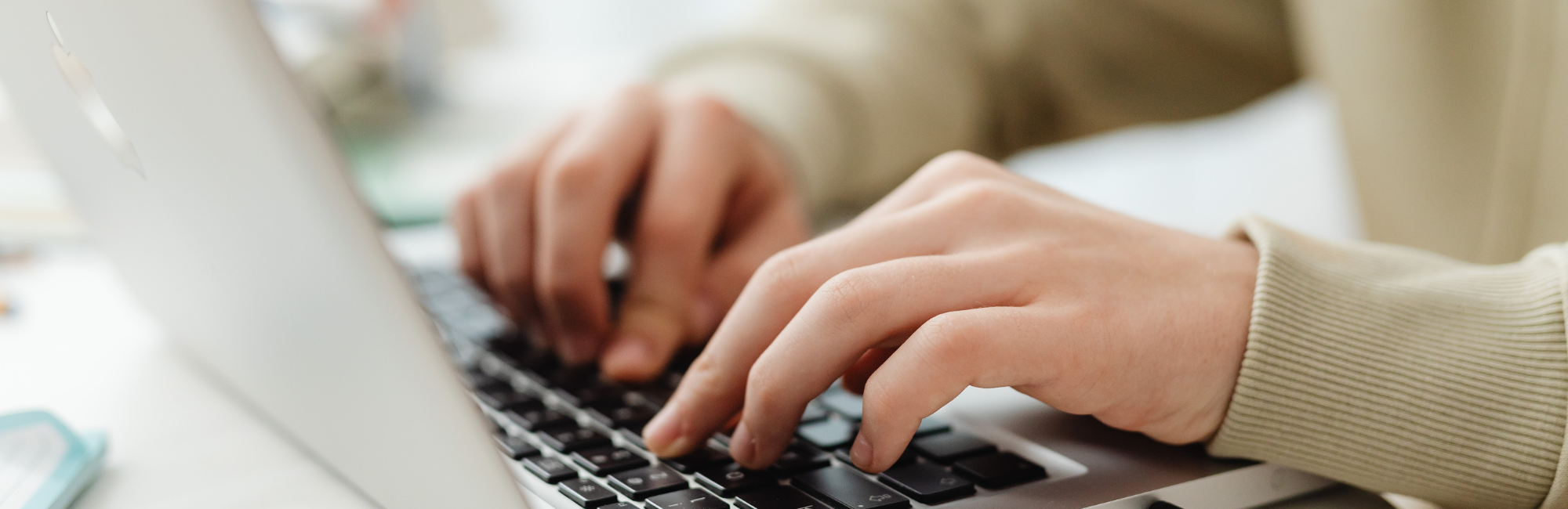 A person typing on a laptop.